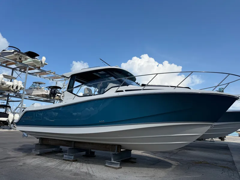 Slide: The Image of Boston Whaler 325 Conquest 2027 - 1