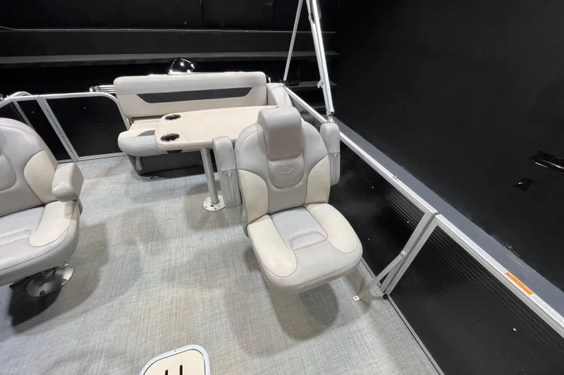 Slide: The Image of 2023 Princecraft Vectra 23 boat interior with comfortable seating and table setup. - 10