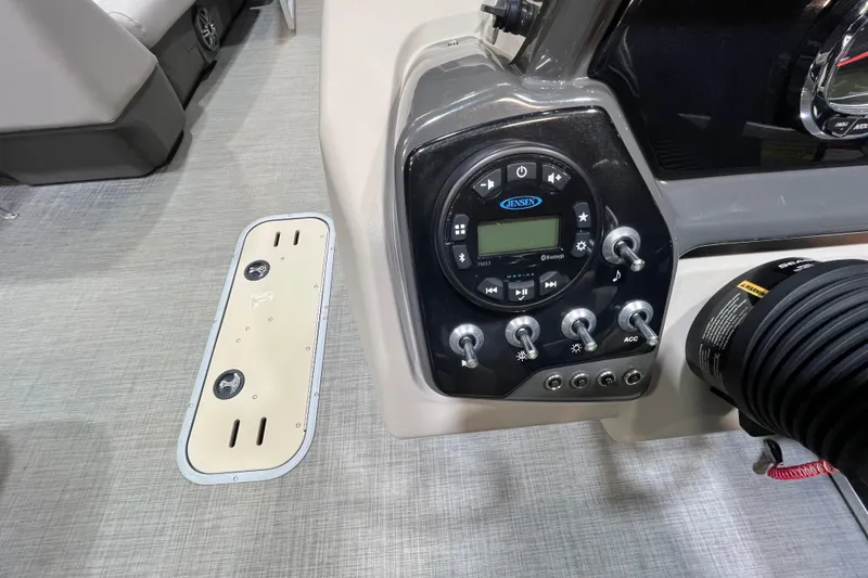 Slide: The Image of Control panel of a 2023 Princecraft Vectra 23 boat with audio system and switches. - 14