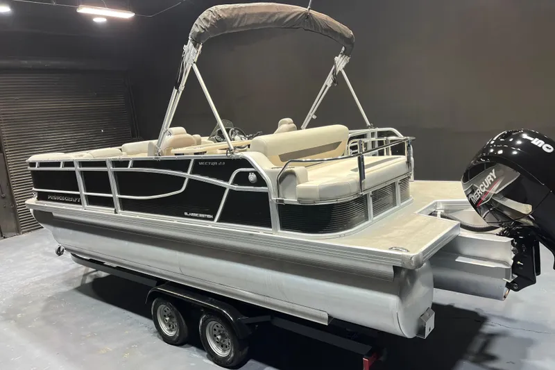 Slide: The Image of 2023 Princecraft Vectra 23 pontoon boat with Mercury outboard motor on trailer. - 3