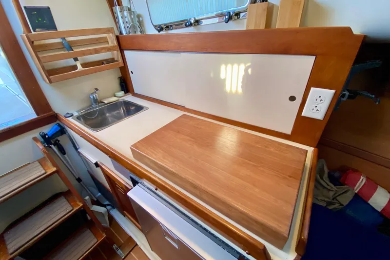 Slide: The Image of Legacy Yachts 28 2003 control panel with 12V and 120V systems. - 11