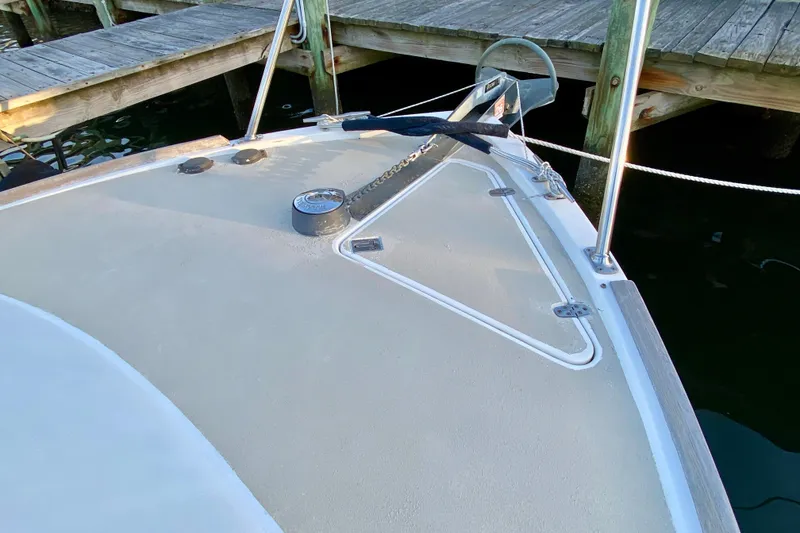 Slide: The Image of 2003 Legacy Yachts 28 swim platform with ladder on calm water. - 21