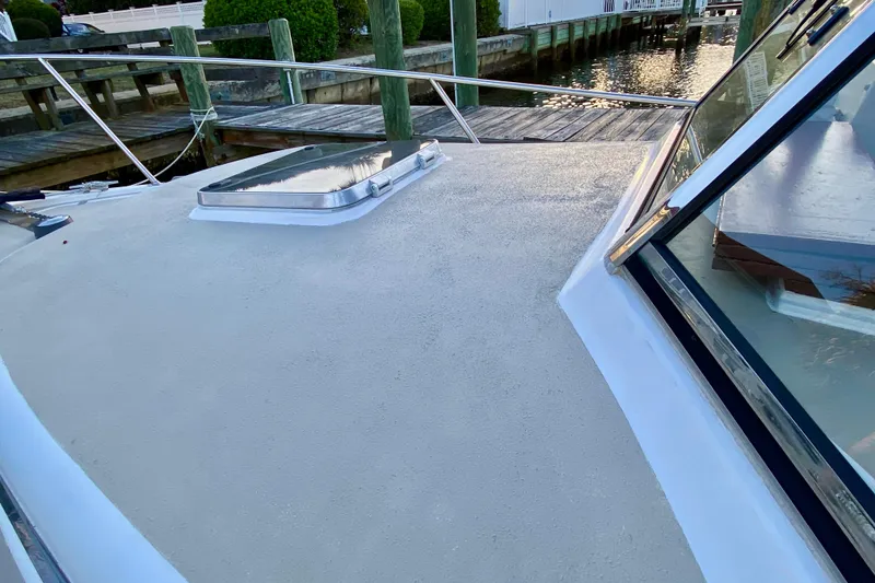 Slide: The Image of Legacy Yachts 28, 2003 model, featuring elegant gold lettering on the hull. - 22