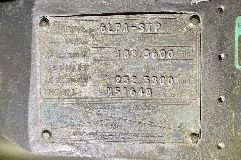 Slide: The Image of 2003 Legacy Yachts 28 with striped seating and enclosed cockpit at dock. - 28