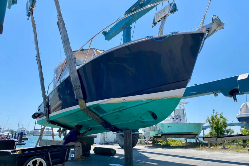 Slide: The Image of 2003 Legacy Yachts 28 sailboat in dry dock for maintenance. - 34