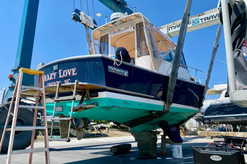 Slide: The Image of 2003 Legacy Yachts 28 boat named "Crazy Love" in dry dock for maintenance. - 35
