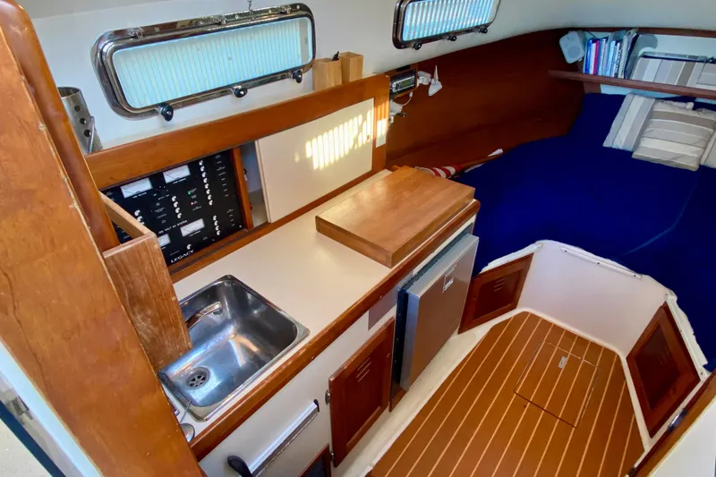 Slide: The Image of Helm of 2003 Legacy Yachts 28 with navigation instruments and controls. - 6