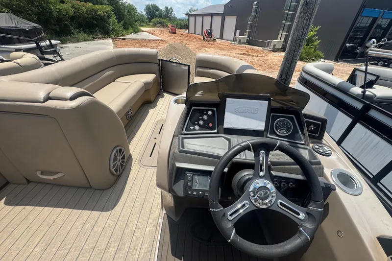 Slide: The Image of 2023 Veranda VTX 25RFL pontoon boat interior with steering console and seating. - 3