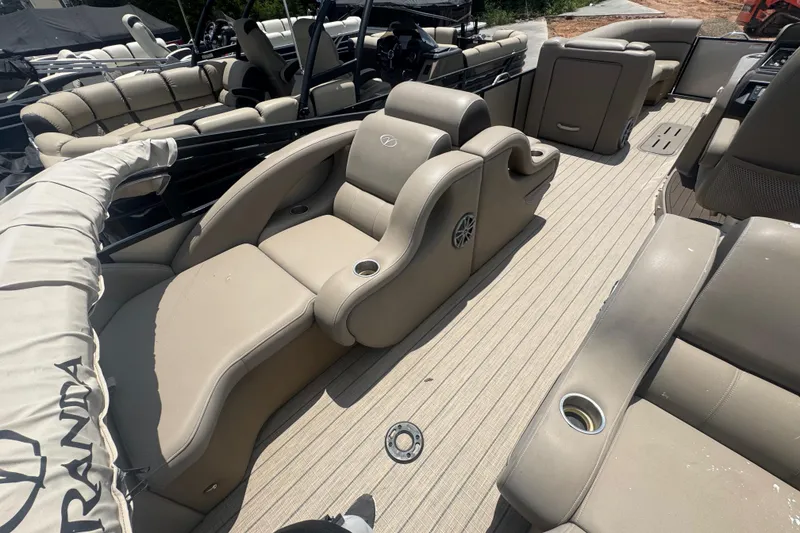 Slide: The Image of 2023 Veranda VTX 25RFL pontoon boat interior with beige seating and cup holders. - 5