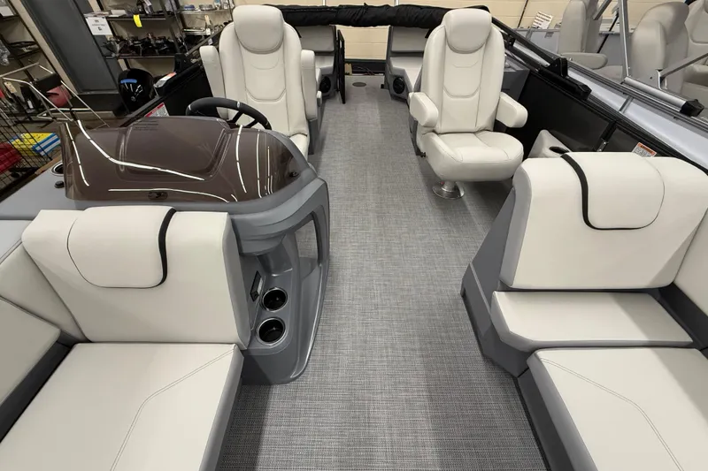 Slide: The Image of Luxurious interior of 2025 SunChaser Lucerne 22 LR DH pontoon boat with plush seating. - 10