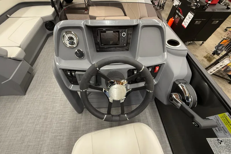 Slide: The Image of Steering console of 2025 SunChaser Lucerne 22 LR DH pontoon boat with modern controls. - 11