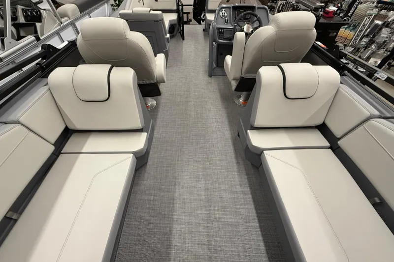 Slide: The Image of Luxurious interior of 2025 SunChaser Lucerne 22 LR DH pontoon boat with plush seating. - 2