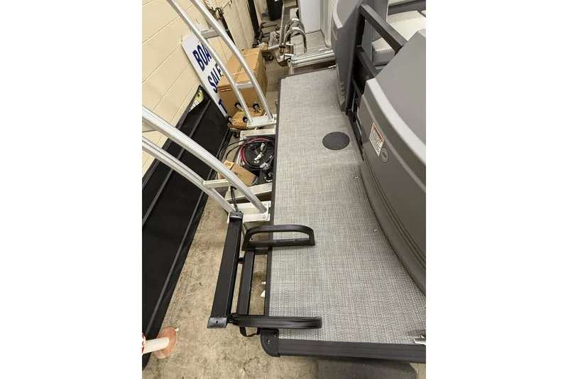 Slide: The Image of 2025 SunChaser Lucerne 22 LR DH boat deck with ladder and railing. - 4