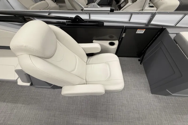 Slide: The Image of Luxurious seating on 2025 SunChaser Lucerne 22 LR DH pontoon boat, featuring plush white upholstery. - 7