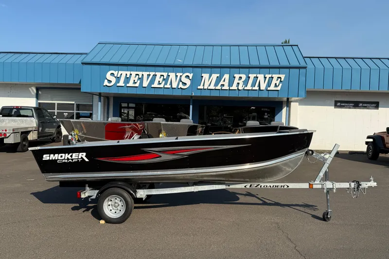 The Image of 2025 Smoker Craft Big Fisherman 14 boat on trailer at Stevens Marine dealership. - 1