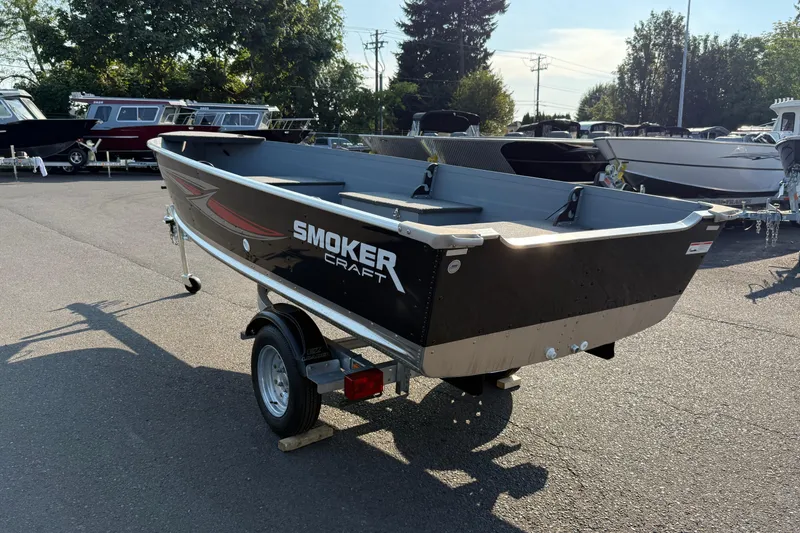 Slide: The Image of 2025 Smoker Craft Big Fisherman 14 boat on trailer in outdoor setting. - 3