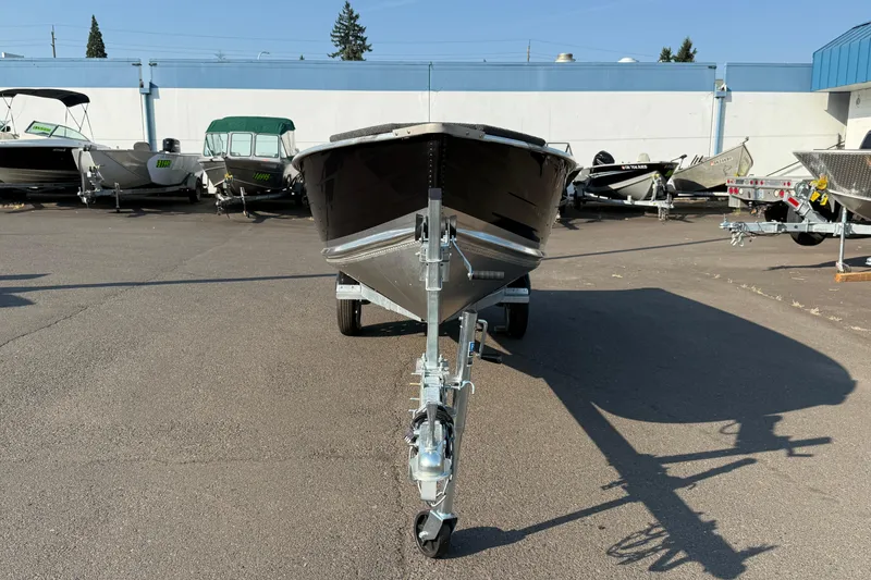 Slide: The Image of 2025 Smoker Craft Big Fisherman 14 boat on trailer in outdoor lot. - 6
