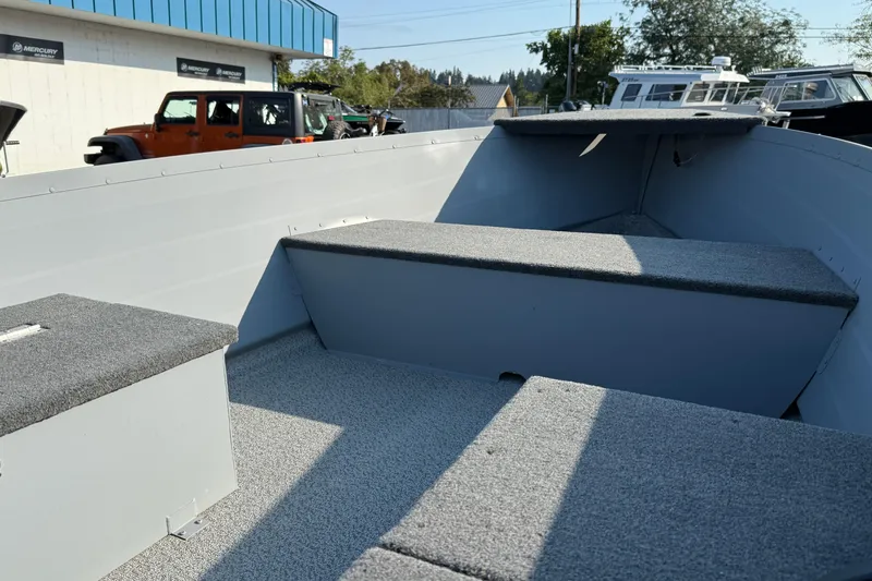 Slide: The Image of 2025 Smoker Craft Big Fisherman 14 boat interior with seating and storage compartments. - 8