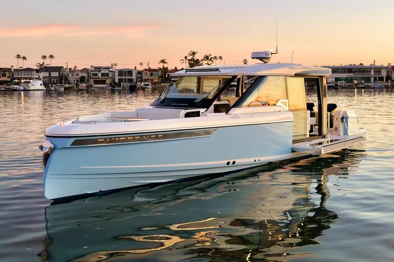 The Image of 2026 Saxdor 400 GTC luxury boat on calm water at sunset, modern design. - 0
