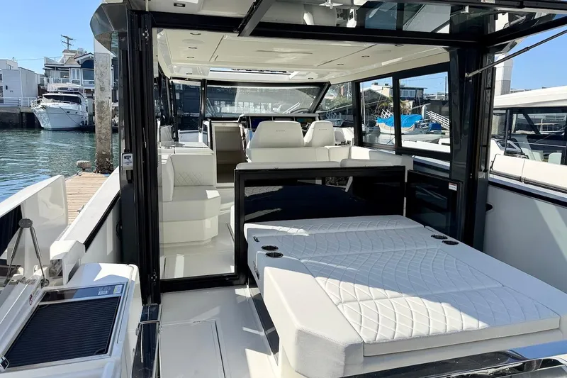 Slide: The Image of Interior view of 2026 Saxdor 400 GTC luxury boat, featuring modern seating and sleek design. - 11