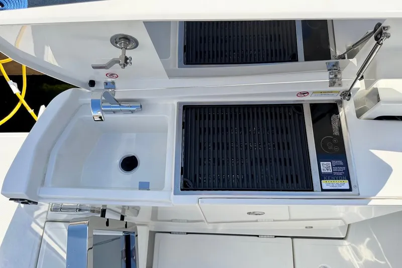 Slide: The Image of Saxdor 400 GTC 2026 boat kitchen with sink and grill setup. - 13