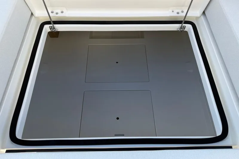 Slide: The Image of Open storage compartment on 2026 Saxdor 400 GTC boat, featuring sleek design and hydraulic supports. - 14