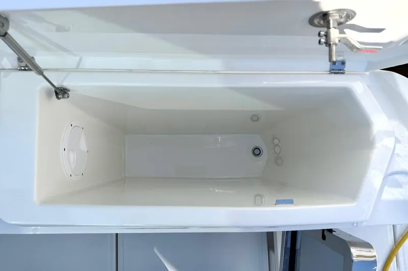 Slide: The Image of Open storage compartment in 2026 Saxdor 400 GTC boat, showcasing interior design. - 15