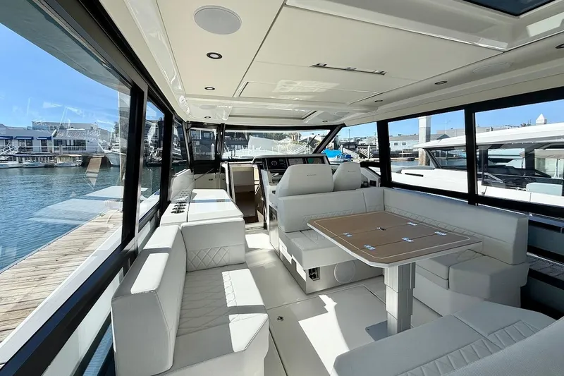 Slide: The Image of Luxurious interior of 2026 Saxdor 400 GTC yacht with modern seating and panoramic windows. - 17