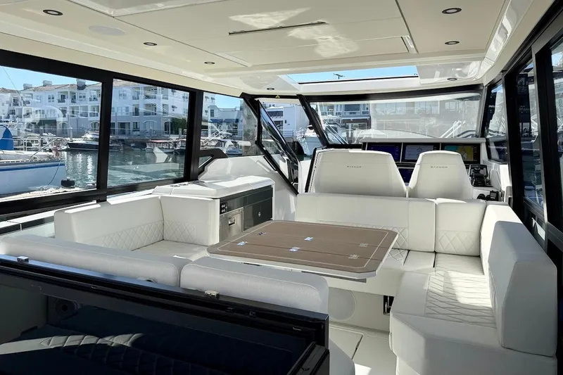 Slide: The Image of Luxurious interior of 2026 Saxdor 400 GTC yacht with white seating and large windows. - 18