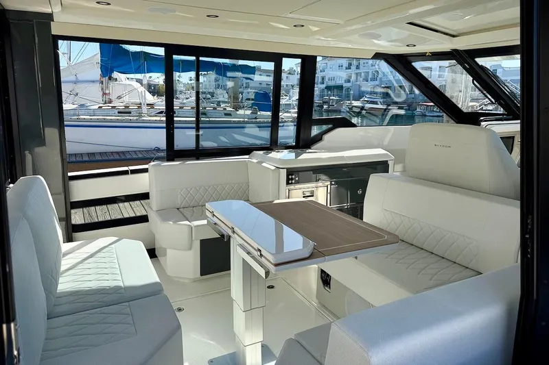 Slide: The Image of Luxurious interior of 2026 Saxdor 400 GTC yacht with modern seating and panoramic windows. - 20