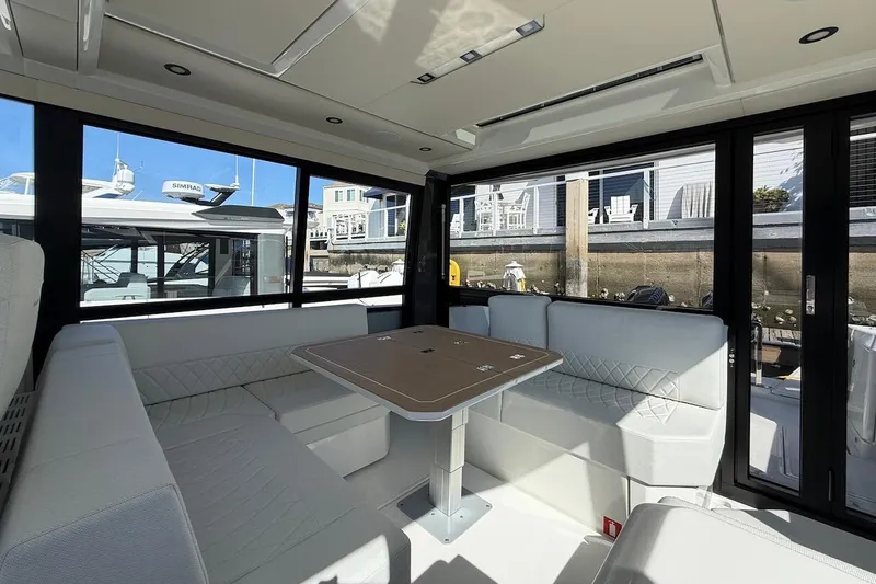 Slide: The Image of Luxurious interior of 2026 Saxdor 400 GTC yacht with elegant seating and table. - 21