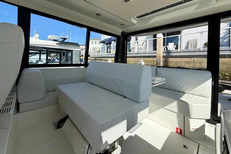 Slide: The Image of Interior of 2026 Saxdor 400 GTC boat with modern seating and large windows. - 22
