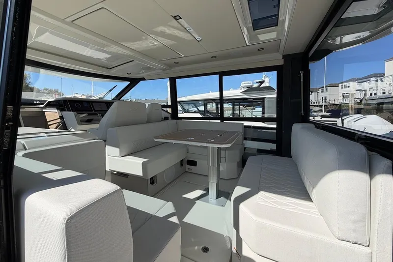 Slide: The Image of Luxurious interior of 2026 Saxdor 400 GTC yacht with modern seating and panoramic windows. - 23