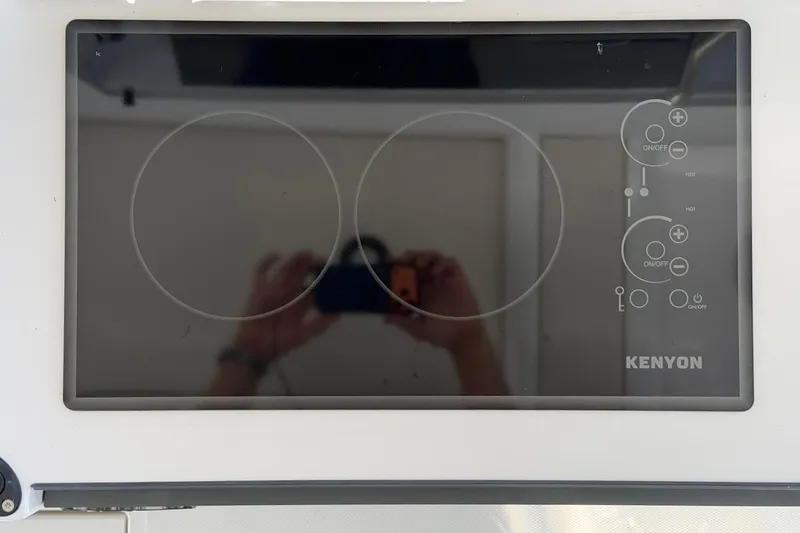 Slide: The Image of Kenyon electric cooktop on Saxdor 400 GTC, 2026 model, with dual burners and control panel. - 28