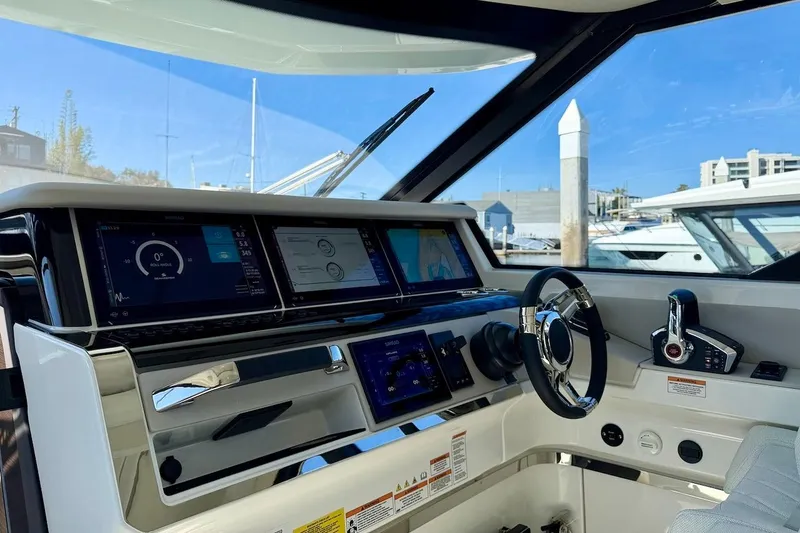 Slide: The Image of Cockpit of 2026 Saxdor 400 GTC with advanced navigation displays and controls. - 29