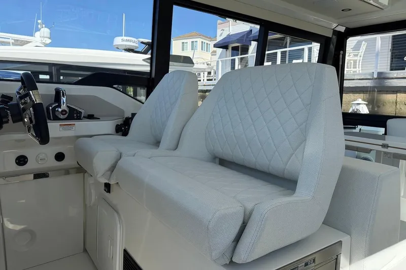 Slide: The Image of Interior of 2026 Saxdor 400 GTC boat with modern seating and steering wheel. - 30