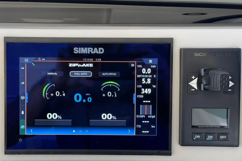 Slide: The Image of Simrad control panel on 2026 Saxdor 400 GTC boat, displaying navigation and system settings. - 32