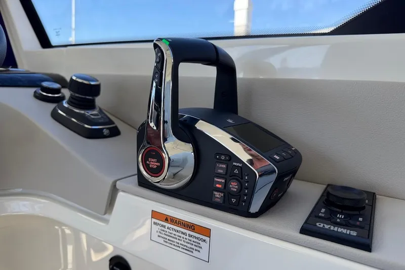 Slide: The Image of Control panel of 2026 Saxdor 400 GTC boat, featuring advanced navigation and throttle controls. - 34