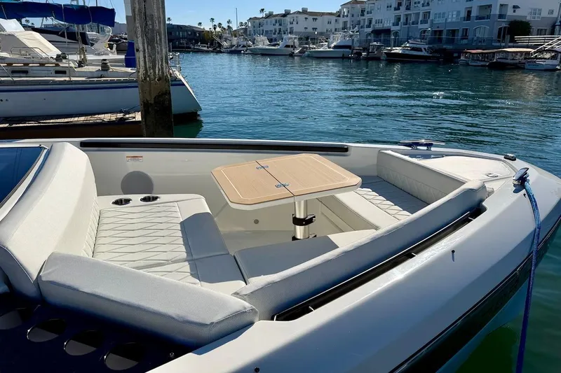 Slide: The Image of Luxurious Saxdor 400 GTC 2026 boat interior with seating and table, docked in a marina. - 40