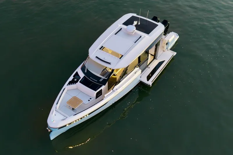 Slide: The Image of 2026 Saxdor 400 GTC luxury yacht on calm water, aerial view. - 7