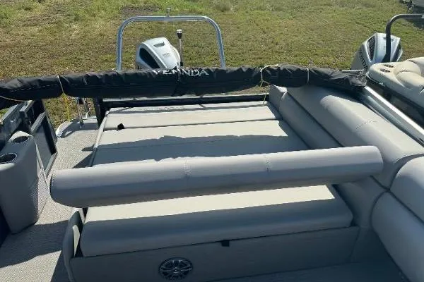 Slide: The Image of 2024 Veranda VTX 22VLB pontoon boat with spacious seating and modern design. - 4