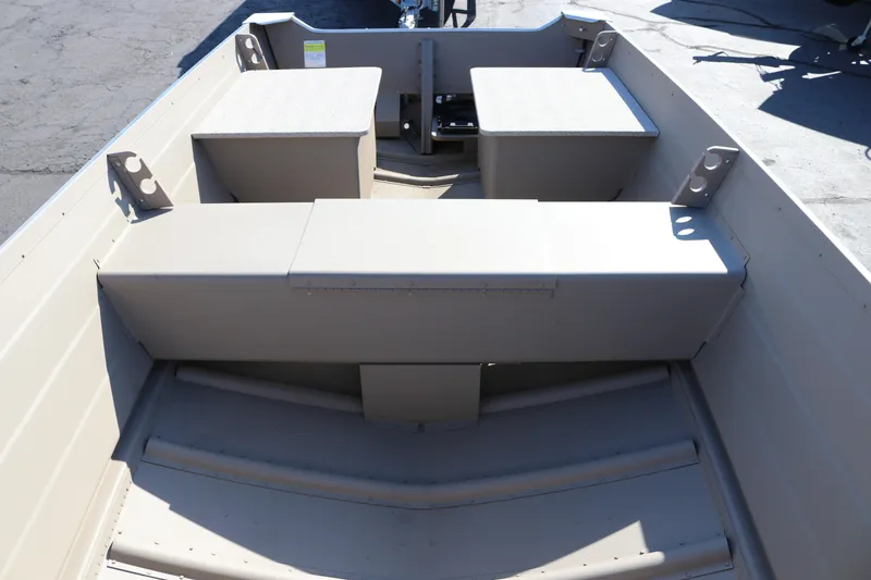 Slide: The Image of 2025 Smoker Craft Voyager 16 interior with seating and storage compartments. - 10