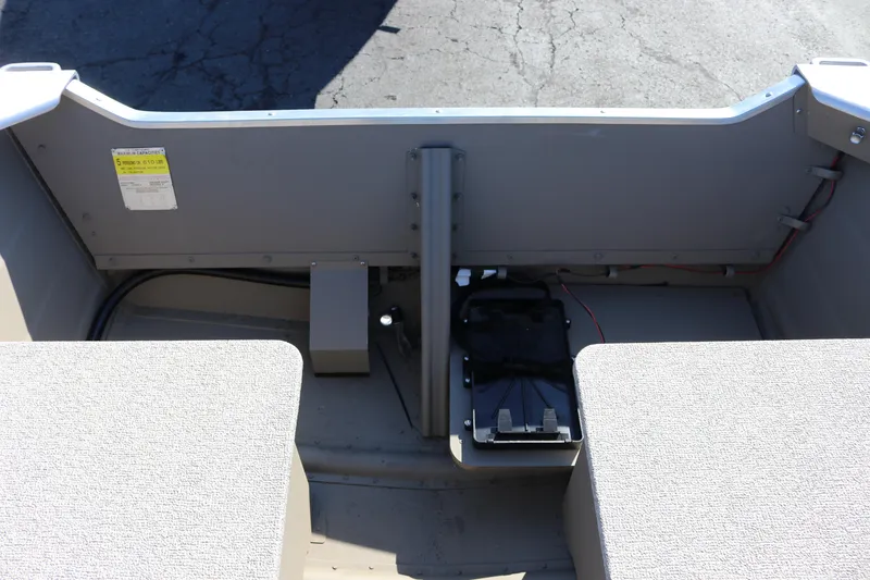 Slide: The Image of 2025 Smoker Craft Voyager 16 boat interior with seating and control panel. - 12