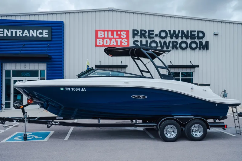 The Image of 2024 Sea Ray SPX 230 boat on trailer at Bill's Boats pre-owned showroom. - 0