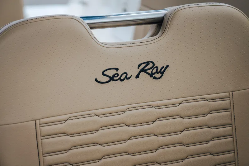 Slide: The Image of Beige leather seat with "Sea Ray" logo on 2024 SPX 230 boat. - 8