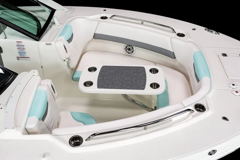 Slide: The Image of Manufacturer Provided Image: 2025 Robalo R317 Dual Console boat interior with cushioned seating and table. - 5
