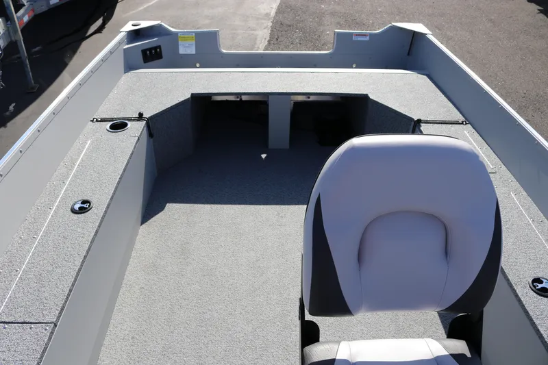 Slide: The Image of 2025 Smoker Craft Angler 16 XL TL boat interior with seating and storage compartments. - 10