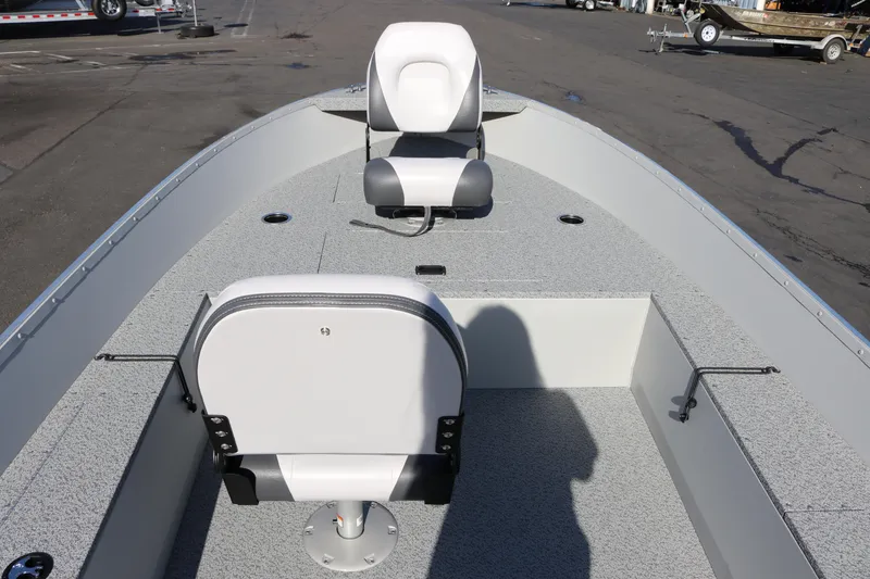 Slide: The Image of 2025 Smoker Craft Angler 16 XL TL boat interior with two seats and gray flooring. - 9