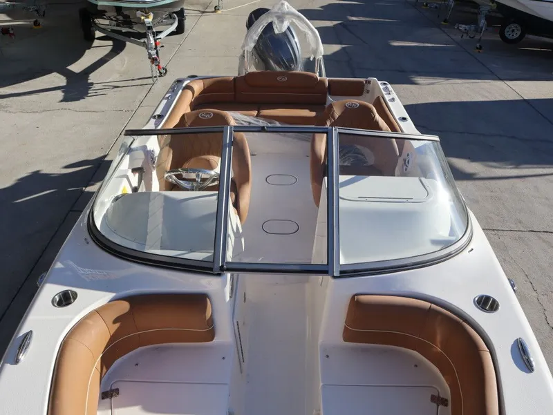 Slide: The Image of Key West 203 DFS boat 2026 with brown leather seats. - 10