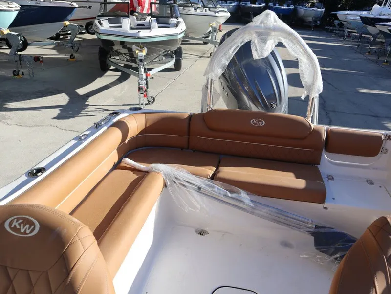 Slide: The Image of Interior of Key West 203 DFS boat, 2026 model, featuring brown leather seats. - 14